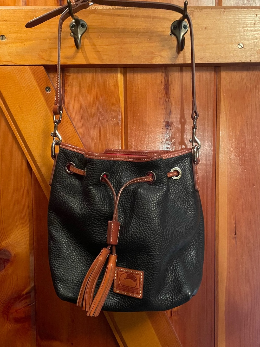 Dooney & Bourke Aimee Black Pebble Leather Drawstring Bucket Bag with Brown Trim